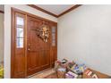 Entryway with a hardwood floor, door with a wreath, and decorations at 3412 Hackney Ct, Raleigh, NC 27613