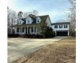 Charming two-story home featuring a wide front porch with columns and a two car garage at 42 Miry Branch Ct, Garner, NC 27529