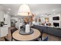 Open concept living area featuring kitchen, dining, and living room areas with modern decor at 1017 Freestone Rd, Durham, NC 27703
