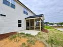This home features a screened in porch, with a view of the pond at 1063 Fairhaven Dr # 54, Mebane, NC 27302