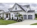 Charming two-story home with a two car garage and an expansive, well-maintained lawn at 113 Nate Court Ct, Wake Forest, NC 27587