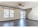Bright living room with hardwood floors, large windows, and a welcoming entryway at 117 Crabwall Ct, Holly Springs, NC 27540