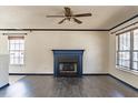 Cozy living room featuring a fireplace, hardwood floors, and neutral color palette at 117 Crabwall Ct, Holly Springs, NC 27540