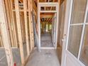 Unfinished entryway showcases the home's framework and a glimpse of the natural light at 1905 Old Bramble Ln # 4, Fuquay Varina, NC 27526