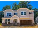 A charming two-story home features a two-car garage and classic design at 1905 Old Bramble Ln # 4, Fuquay Varina, NC 27526