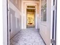 View of the foyer featuring hexagon tile flooring and a glimpse into the home's interior, showcasing natural light at 1905 Old Bramble Ln # 4, Fuquay Varina, NC 27526