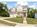 Charming two-story home with attached two-car garage and lush green lawn at 200 Single Tree Cir, Haw River, NC 27258