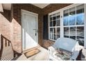 Close-up of the porch with a welcome mat and chair at 2203 Eider Ct # A, Graham, NC 27253
