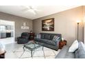 Cozy living room featuring neutral paint, plush seating, and lots of natural light at 2203 Eider Ct # A, Graham, NC 27253