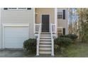 Inviting home front porch featuring well-kept landscaping and classic design elements at 224 Hartshorn Ct, Holly Springs, NC 27540