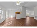 Open floor plan with wood flooring and access to the kitchen at 224 Hartshorn Ct, Holly Springs, NC 27540