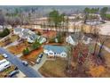 An aerial view features the neighborhood with well-maintained homes surrounded by lush trees at 2576 Mint Julep Dr, Creedmoor, NC 27522