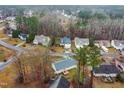 An aerial view shows the neighborhood homes nestled among the trees in a well-established residential area at 2576 Mint Julep Dr, Creedmoor, NC 27522