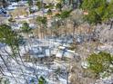 Stunning aerial view of snow covered homes surrounded by trees and greenery at 316 Russ Rd, Smithfield, NC 27577
