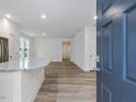 Inviting home entryway featuring an open layout and luxury vinyl plank flooring at 326 Church St # 42, Wendell, NC 27591