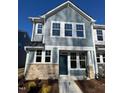 Charming two-story home with light-blue siding, white trim, and a well-manicured front yard at 334 Church St # 46, Wendell, NC 27591