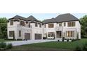 Beautiful new construction features painted brick, stone accents, two car garage, and manicured lawn at 3601 Alamance Dr, Raleigh, NC 27609