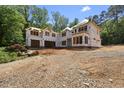 Two-story home under construction features a full unfinished basement and a charming wooded lot at 3601 Alamance Dr, Raleigh, NC 27609