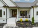 Inviting front porch with elegant landscaping, decorative lighting, and stylish seating perfect for enjoying the outdoors at 4622 Durham Rd, Wake Forest, NC 27587
