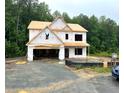 Exterior framing of a two-story home in progress, showcasing the architectural design at 507 Olivia Crossing Ct # 20, Four Oaks, NC 27524