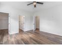 Spacious main bedroom with modern ceiling fan, en-suite bathroom, and walk-in closet at 620 Gilmer St, Burlington, NC 27217