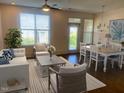 Bright and airy living room featuring hardwood floors, natural light, and modern decor at 700 Finsbury St # 304, Durham, NC 27703