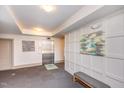 Modern apartment lobby with neutral walls, elevator access, and sleek gray bench seating at 700 Finsbury St # 304, Durham, NC 27703