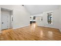 Open living space with hardwood floors, natural light, and a view into the kitchen at 917 S Blount St, Raleigh, NC 27601