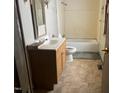 Functional bathroom showcasing a vanity, toilet, and tub, ready for renovation and customization at 922 N White St, Wake Forest, NC 27587