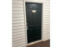 Apartment 1647 front door with black paint and white trim at 1647 Kenmore Dr, Clayton, NC 27520