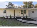 Welcoming front porch with new landscaping and fresh exterior paint at 1924 Carr Crk, Sanford, NC 27332