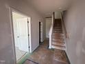 Hallway view featuring a staircase and entryway to another room at 312 Chesapeak Commons St # 144, Garner, NC 27529
