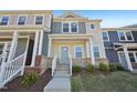 Charming townhome with a welcoming front porch and well-manicured landscaping at 3725 Rosebush Dr, Zebulon, NC 27597