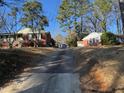 Street view of the home, showing the driveway and neighboring house at 402 Willow St, Cary, NC 27511