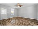 Bright bedroom featuring a ceiling fan and gleaming wood floors at 410 N Lamar St, Roxboro, NC 27573