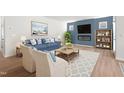 Bright open-concept living room with fireplace, stylish furniture, and dining area at 60 Commons Cir, Clayton, NC 27520