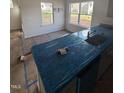 New kitchen with countertops protected by blue plastic at 60 Commons Cir, Clayton, NC 27520
