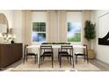 Dining room featuring a modern table with six chairs, a decorative rug, and abundant natural light at 607 Cassa Clubhouse Way, Knightdale, NC 27545