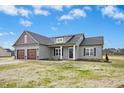 Charming single-story home boasts a two-car garage and inviting front entrance at 618 Tart Town Rd, Dunn, NC 28334