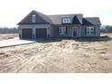 This new construction home features a two-car garage, covered entry, and tasteful design at 618 Tart Town Rd, Dunn, NC 28334