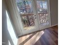 A close up of the double-door access to a wooden outdoor balcony at 806 Kendall Dr, Durham, NC 27703
