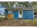 Blue siding and a white door accent the exterior of this quaint home at 915 E Holly St, Rocky Mount, NC 27801