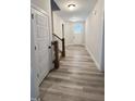 Entryway with wood flooring and a staircase leading to the next level of the home at 1013 Greatland Road, Durham, NC 27703