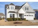 Attractive two-story home showcasing a well-maintained lawn and an attached garage at 130 Ivory Ln, Raleigh, NC 27610