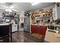 A kitchen with stainless steel refrigerator, ample counter space, and dark wood floors at 1469 Mollie Mooney Rd, Roxboro, NC 27574