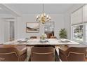 Dining room showcasing a marble table and elegant chandelier, perfect for gatherings at 200 Indian Elm Ln, Cary, NC 27519
