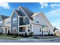 Beautiful townhomes showcasing modern architecture, with eye-catching colors, professional landscaping, and street view at 2465 Englemann Dr # 365, New Hill, NC 27562