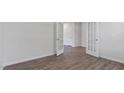 Versatile room featuring French doors, wood-look floors, and neutral walls at 261 Hawksmoore Ln, Lillington, NC 27546