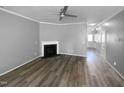 Bright living room featuring a fireplace and ceiling fan at 3804 Prince Noah, Wake Forest, NC 27587