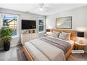 Inviting bedroom with natural light, a ceiling fan, and modern decor at 4820 Landover Arbor Pl, Raleigh, NC 27616
